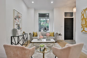 a living room filled with furniture and a fire place